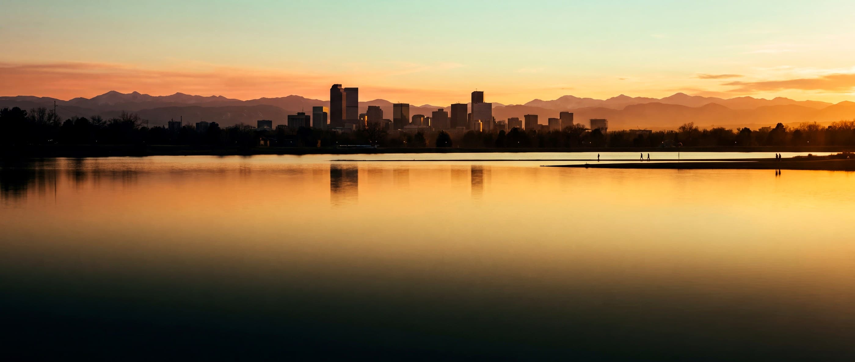 Denver skyline across Sloan's Lake at golden hour
